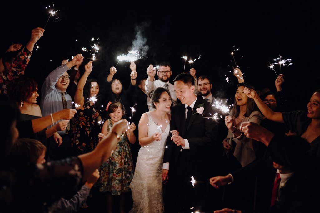 Stunning fireworks wedding photography of bride and groom at end of reception